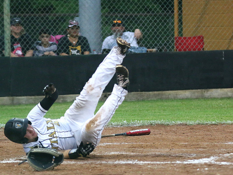 Image: Slide Fail! Micah Escamilla(4) demonstrates the improper way to slide into home base. The effort may have lacked style points but the run counted for the Gladiators just the same. Great job, Micah!