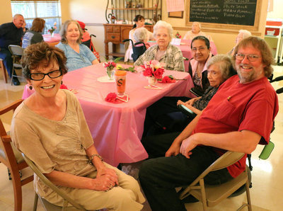 Image: Everyone was having fun during the Mother’s Day celebration as Shirley Wakeland (Front) spends time with her family and sister, Leona Cockerham, a resident at Trinity.