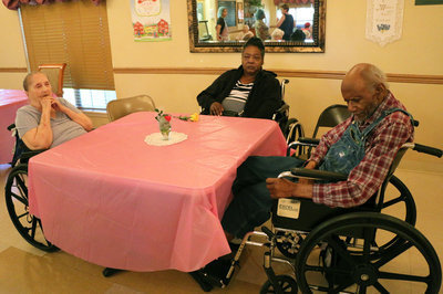 Image: Trinity residents were eager to pose for pictures but were more eager for punch and cookies.