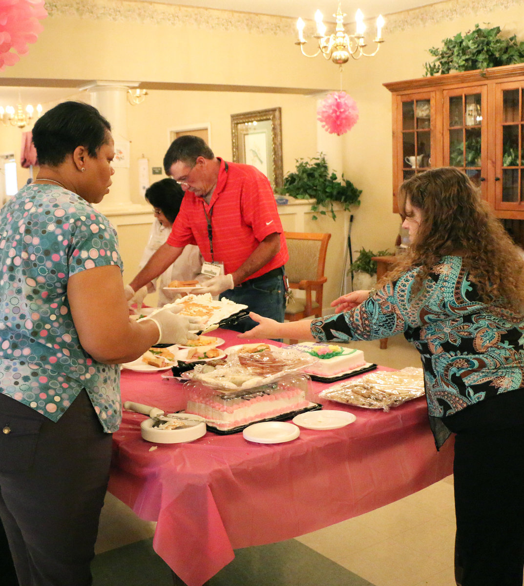 Image: Trinity staff members keep the dishes coming…Who wants seconds?