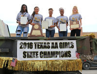 Image: The Italy Lady Gladiator 2016 Conference AA State Champion Track Team members Janae Robertson, April Lusk, T’Keyah Pace, Chardanae Talton and Halee Turner present their City of Italy proclamations and state trophies. The team  rode in the back of a camo painted city dump truck during a downtown parade held in their honor on Friday.