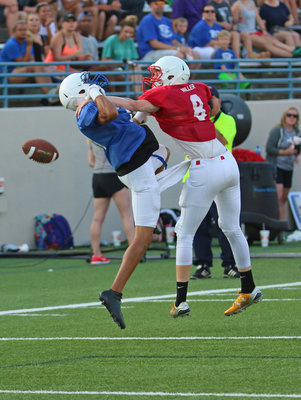 Image: Red squad’s Clayton Miller(8) proves that sometimes the best offense is a good defense as the receiver from Italy ensures his offense will have another chance.