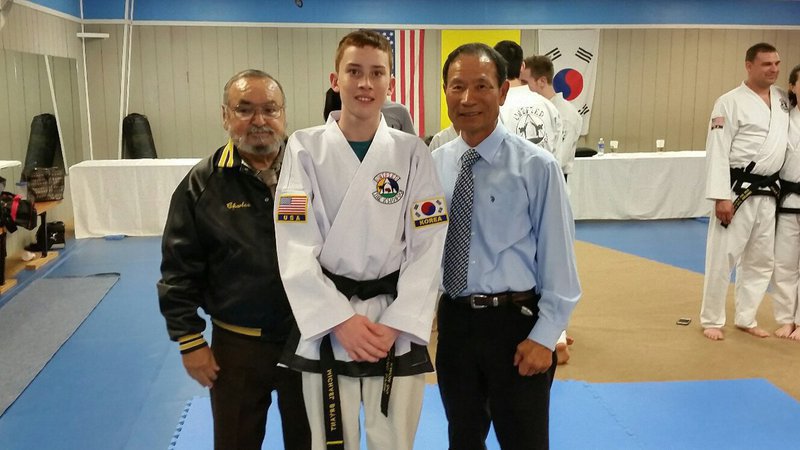 Image: Pictured are Master Charles Kight, Michael and Grand Master BuKwon Park.