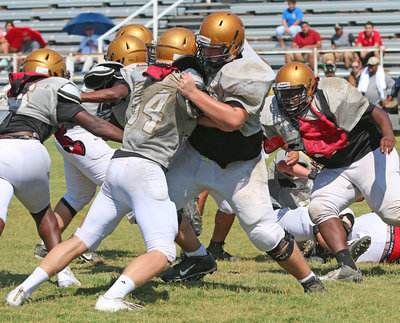 Image: Offensive tackle Aaron Pittmon #72 seals off the end to allow for another long touchdown run by Italy’s offense.