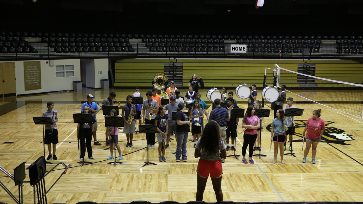 Image: Band students stood while playing their first two songs.