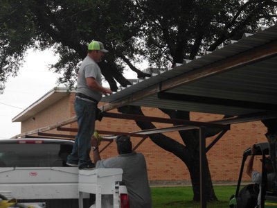 Image: Ken Cate, owner of Cate Welding, is building the covered walkway for the Stafford students.