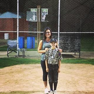 Image: Pitcher Dustyn Lohner poses after the tournament championship game with his mother, Heather.