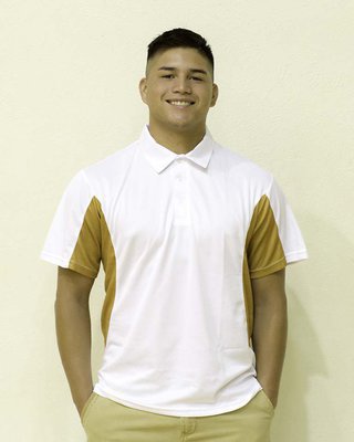 Image: Joe Celis models this traditional shirt for Old Gold Sports which has a three-button color, white body, and old gold accents. Featured online at www.oldgoldsports.net, this style can also be purchased from the Booster Club at games.