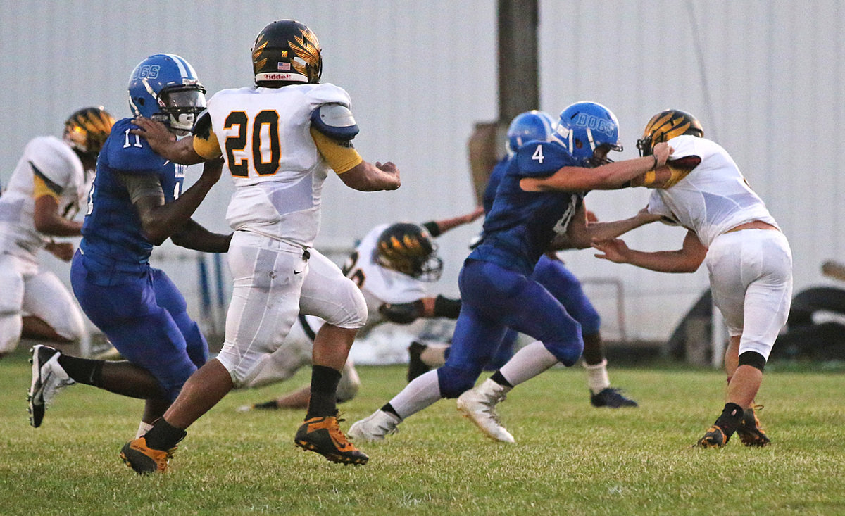 Image: It starts up front with Milford’s #11 Ricky Pendleton and teammate #4 Corbin Schrotke paving the way for the Bulldog’s offense.