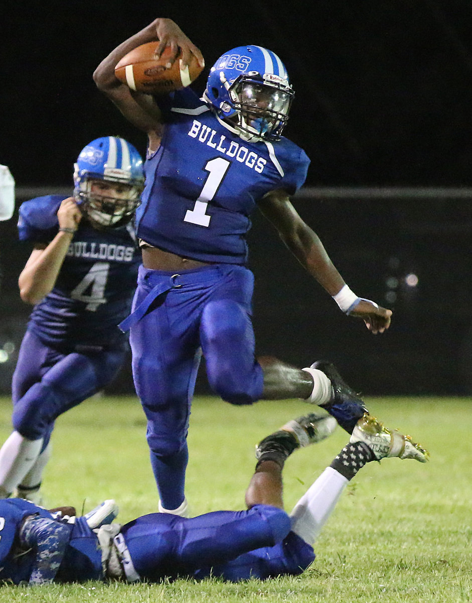 Image: The human highlight reel, #1 Taron Smith, tries to raise the Bulldogs to another level.