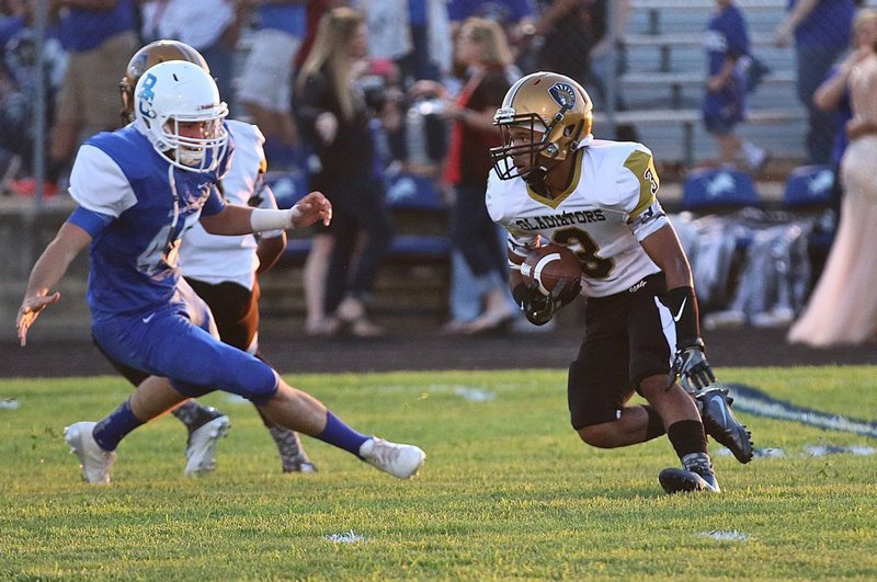 Image: Italy Gladiator #3 Jeremiah Thompson turned a short pass completion from his quarterback, Tylan Wallace, into a 71-yard touchdown early in the first-quarter against the Blooming Grove Lions.