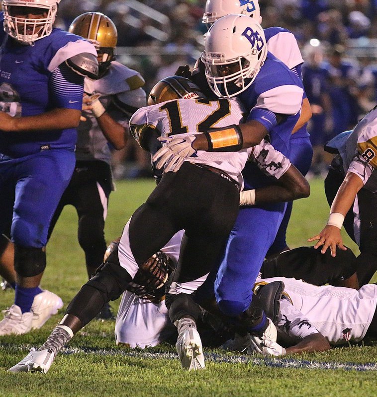 Image: Italy’s #12 Chasston King proves he’s the king of the jungle as he puts the pop on a Blooming Grove Lion running back.