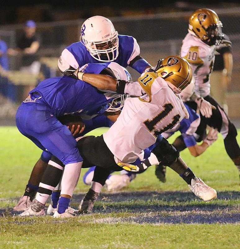 Image: The fabulous #11 Fabian Cortez clamps onto a Lion in the Blooming Grove backfield to secure a tackle for a loss.