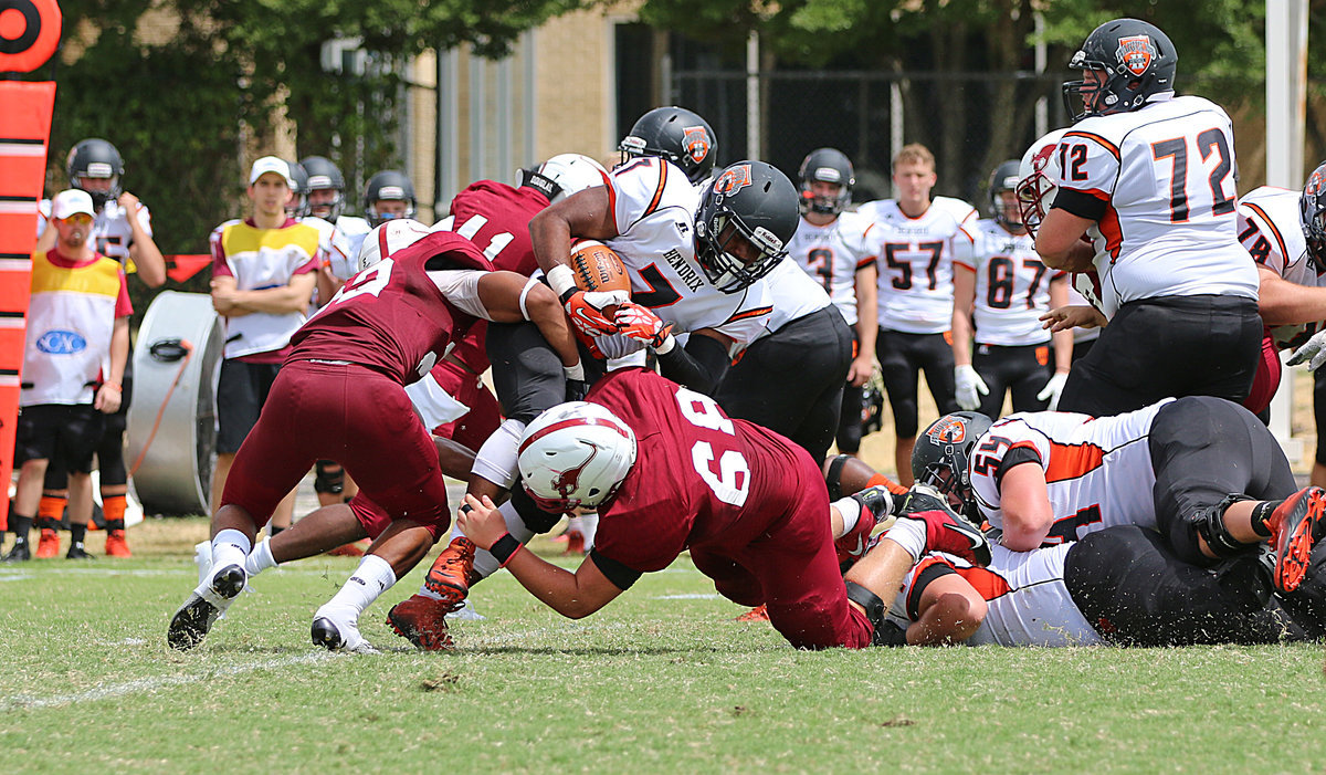 Image: Sophomore Season: During the 2015 season against Hendrix, Austin College sophomore nose guard #68 Zain Byers comes up big on a 4th down stop for the Kangaroos along with teammate #22 Kendall St. Romain, a junior out of Arlington, Texas / Mansfield Timberview.