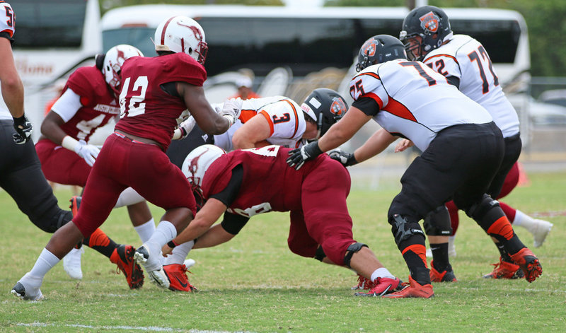 Image: Sophomore Season: Austin College sophomore nose guard #68 Zain Byers making his first official collegiate tackle on play three of the 2015 season opener against Hendrix.