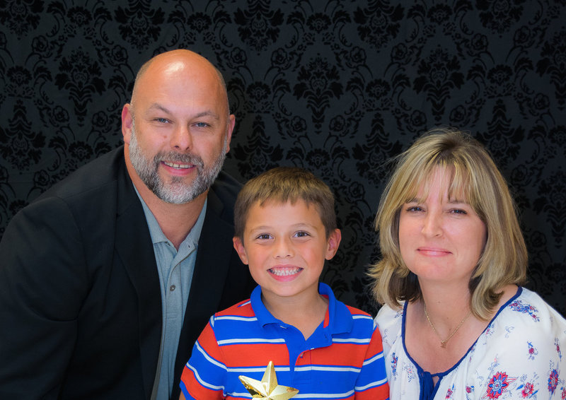 Image: 1st Grade Star Award winner, Jesse Zambrano, is all smiles with his teacher Mrs. Malone and Mr. Joffre.