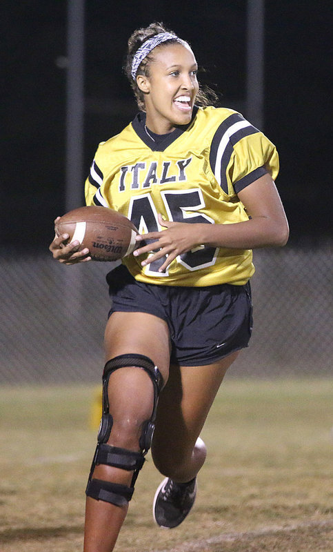 Image: Junior QB/RB Emmy Cunningham is having funning while running during the Powder Puff game.