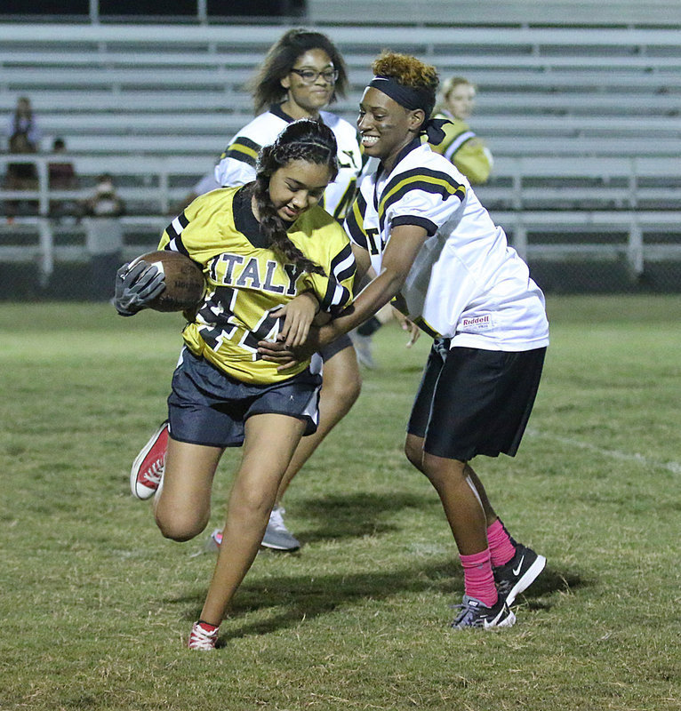 Image: Decorea Green makes a tackle for the senior defense against junior running back Antonia Salazar.