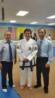 Image: Rocklin Ginnett with Master Charles Kight, Luis and Grand Master BuKwon Park, co founder of Unified Tae Kwon Do.