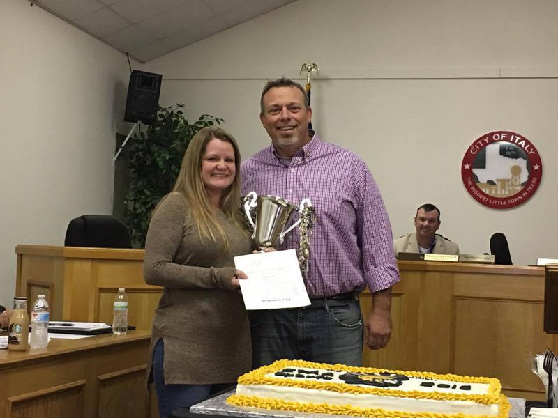 Image: Mayor Farmer presents Amber Cunningham with the proclamation naming her as IYAA Volunteer of the year.