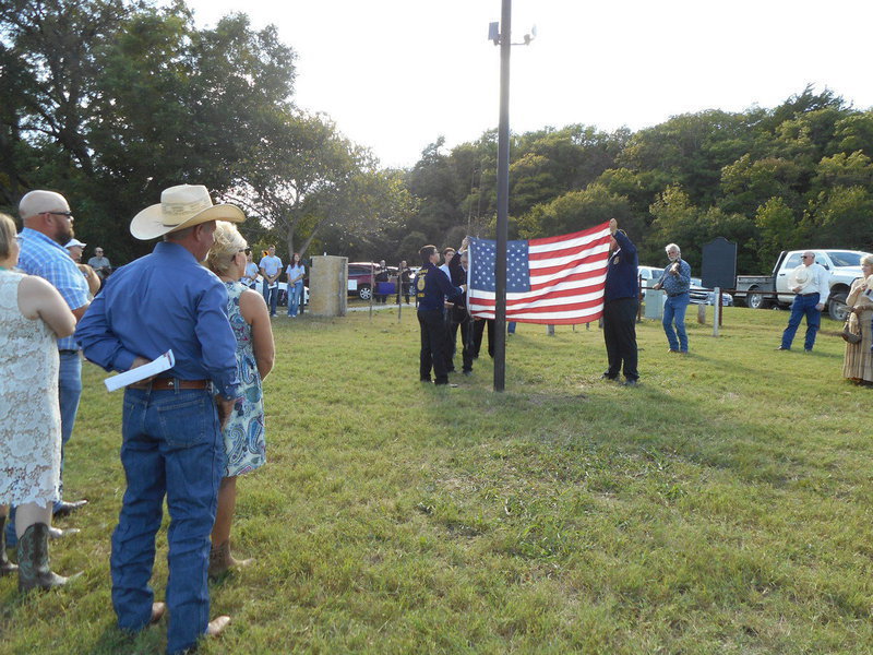 Image: FFA members raising the American Flag.