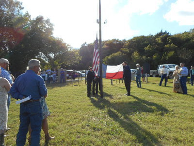 Image: Italy FFA members presenting the Texas flag.