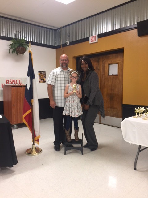 Image: 2nd Grade Superintendent Star Student, Harlee Krusen with Mr. Joffre, Superintendent and Ms. Thomas, Principal of Stafford Elementary