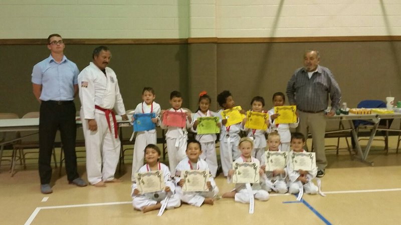 Image: Pictured: Top Row: Travis Tinney, Instructor,  Roger Sam, Turtle Cadet Instructor, Gryphon Kight-Waco, Daniel Goates-West, Jocelyne Crisostomo-Hillsboro, Ryan Thompson-Penelope, David Flores-Hillsboro, Ayden Vargas-Hillsboro and Master Charles Kight-Chief Instructor of the school.
    Front Row:  Elile Morales-Itasca, Fabian Morales-Itasca, Harmony McKnight-Whitney, Christian McKnight-Whitney and Noah Hayes-Italy.