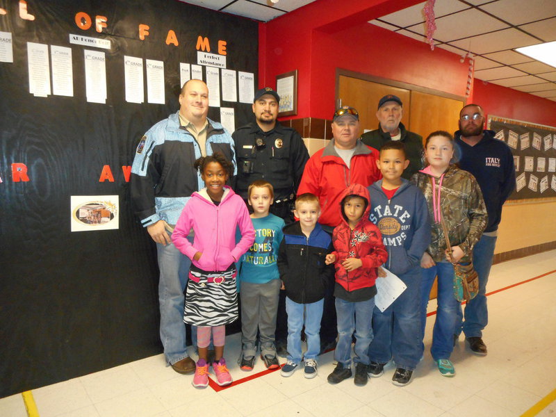 Image: Stafford Students are ready to go shopping with fire fighters and police officers.