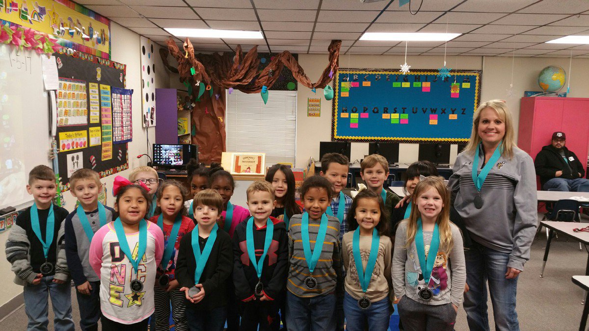Image: Mrs. Nelson’s kindergarten class shows off their medals for winning Carter Blood Care’s contest at Stafford  Elementary—their class had the most donations given in their name.