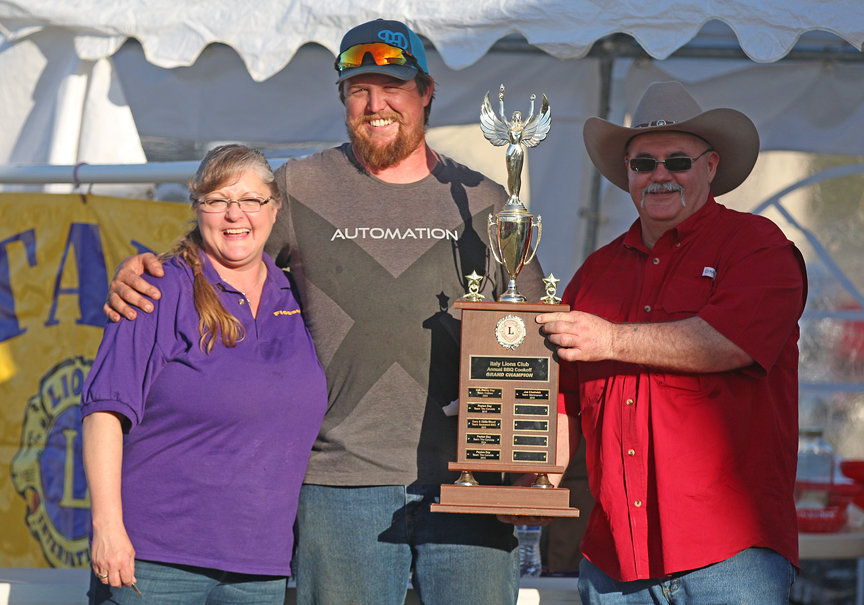 Image: Lions Club members Flossie Gowin and Donald Brummett present the local Braggin’ Rights trophy to Joe Chadwick for the second consecutive year! Flossie’s only request was for Joe to dust it off before bringing it back next year.