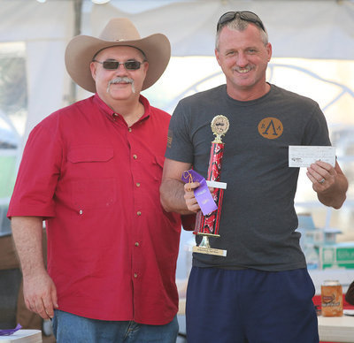 Image: Italy Lions Club member Donald Brummett presents Randy Brumbelow with a ribbon and trophy for 2nd Place in the Pulled Pork category.
