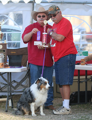 Image: It was also pet day at the BBQ as Italy Lions Club member Donald Brummett  presents David Leflere with a ribbon and trophy.