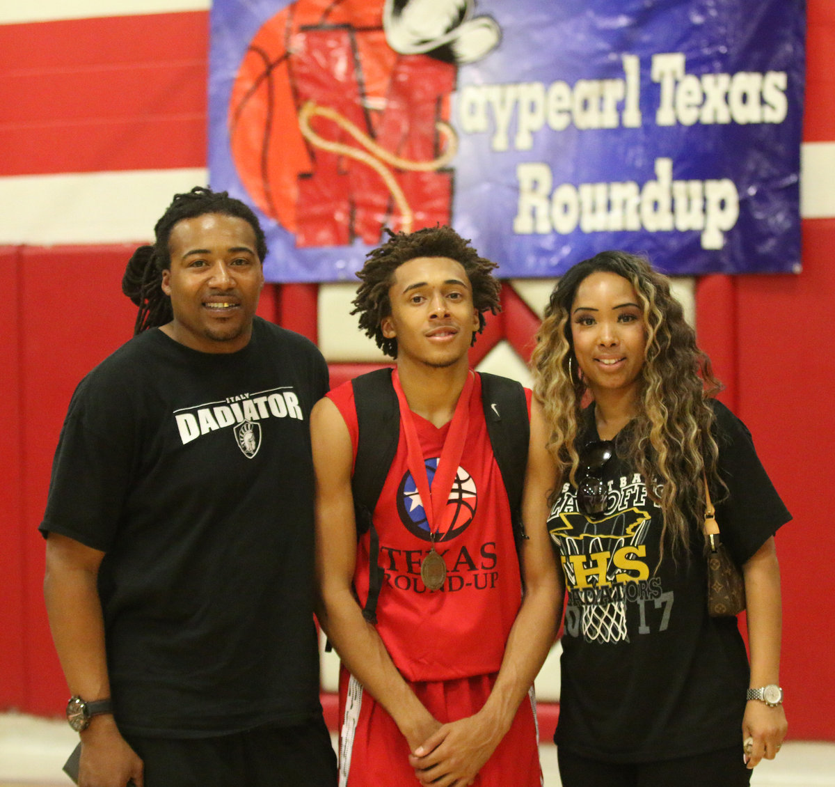 Image: Maypearl Texas Roundup All-Star Keith Davis II, representing Italy Gladiator Basketball, with his parents Keith Davis and Candy Lincoln after the 16th Annual Maypearl Texas Roundup All-Star games hosted by the Maypearl Chamber of Commerce.