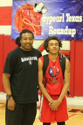 Image: Maypearl Texas Roundup All-Star Keith Davis II, Italy, poses with his father Keith Davis after the game.