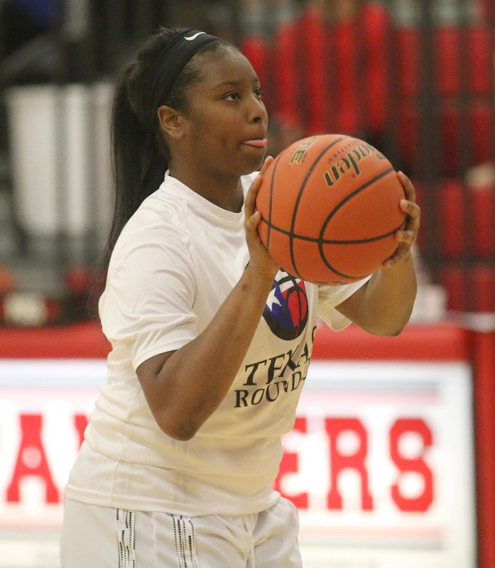 Image: Representing the Italy Lady Gladiators, Aarion Copeland (24) warms up and dials-in before the start if the girls All-Star game.