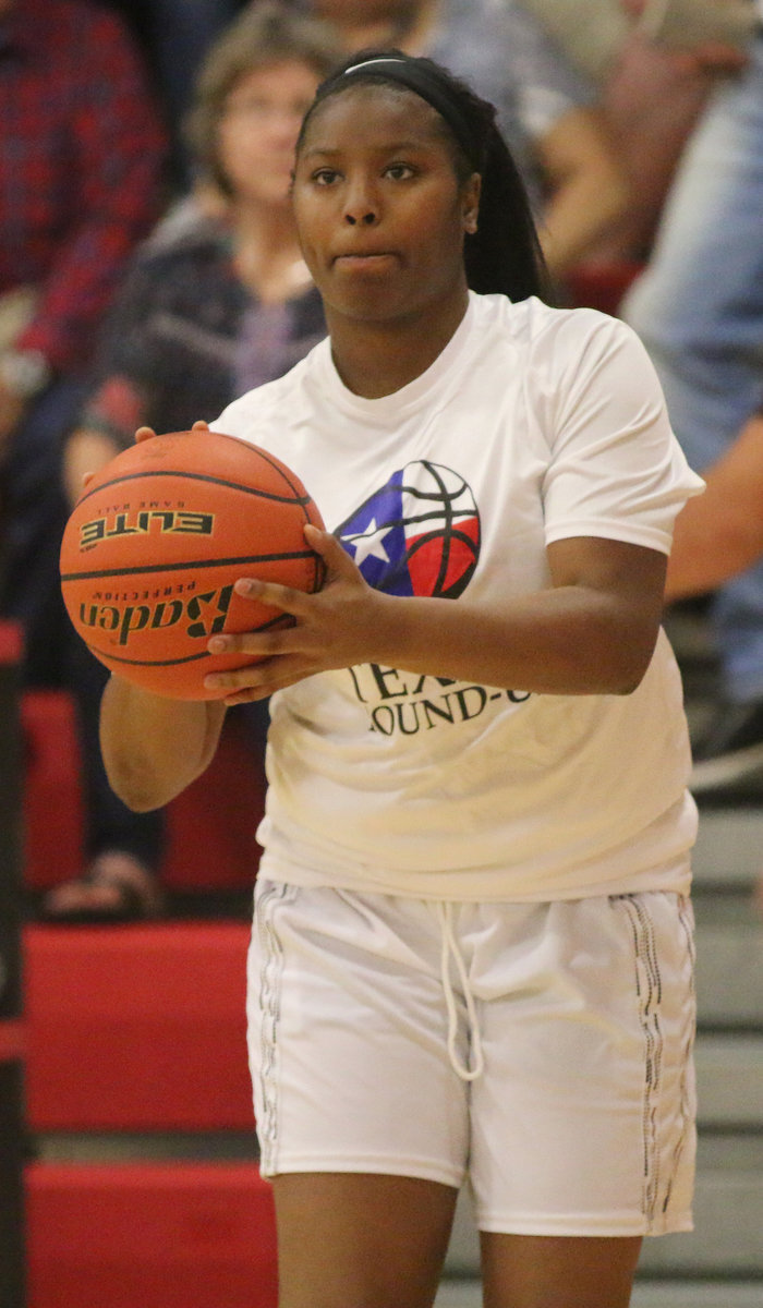 Image: Aarion Copeland, Italy, practices a jumper before tip-off.