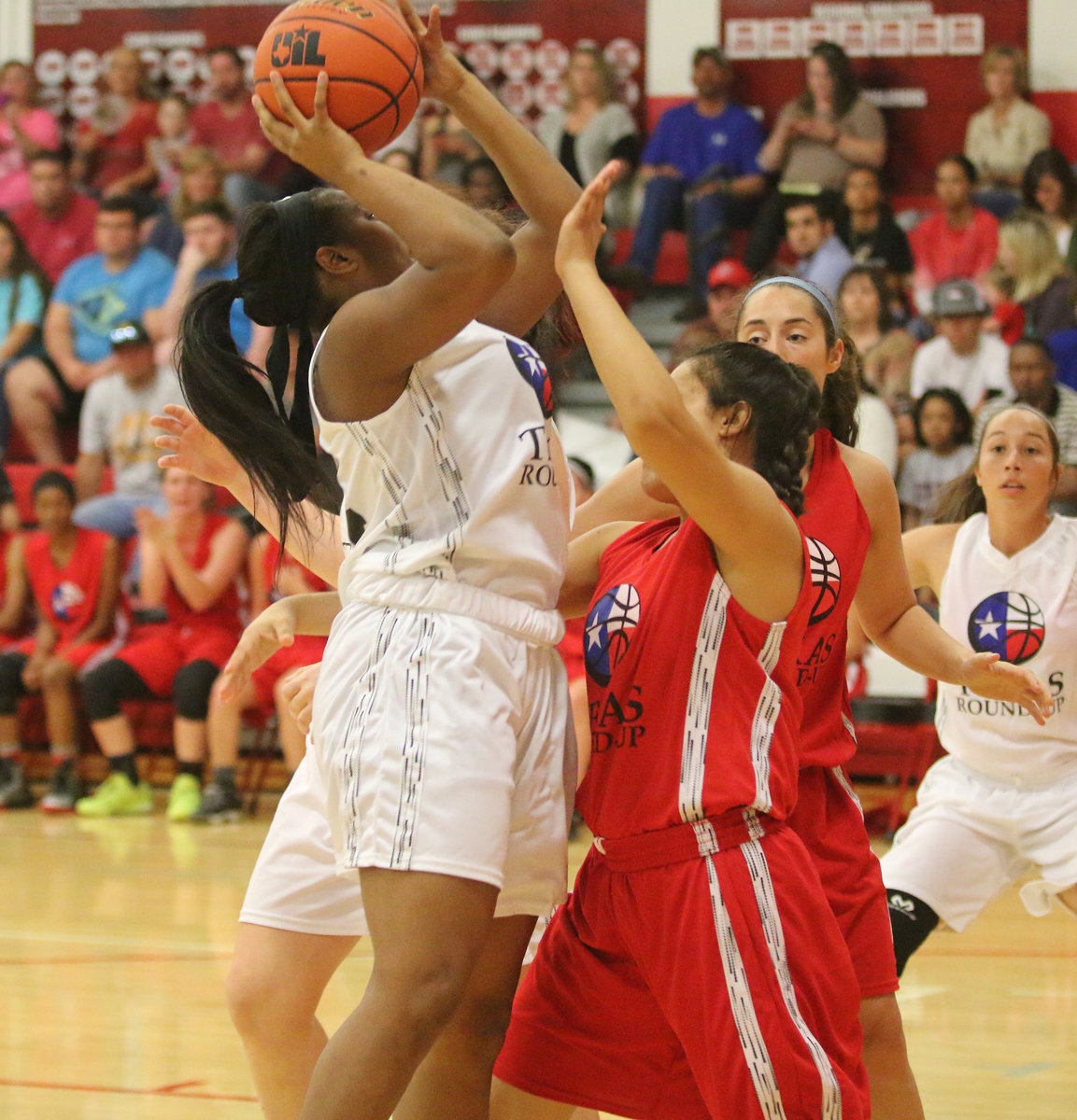 Image: Scoring inside the paint during the 2017 Maypearl Texas Roundup Girls All-Star game is Aarion Copeland (24) of Italy.