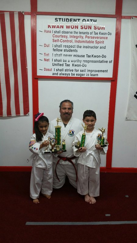 Image: Jocelyne Crisostomo from Hillsboro, Instructor Roger Sam of Italy and Daniel Goates of West brought home the trophies to show the hard work and dedication these two 5 years olds and Mr. Sam have accomplished.
