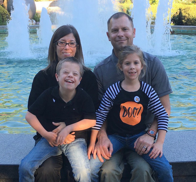 Image: Family Photo:
    Back row left to right: Sophia Creighton, Larry Creighton
    Front row left to right: Warren Creighton, Alex Creighton